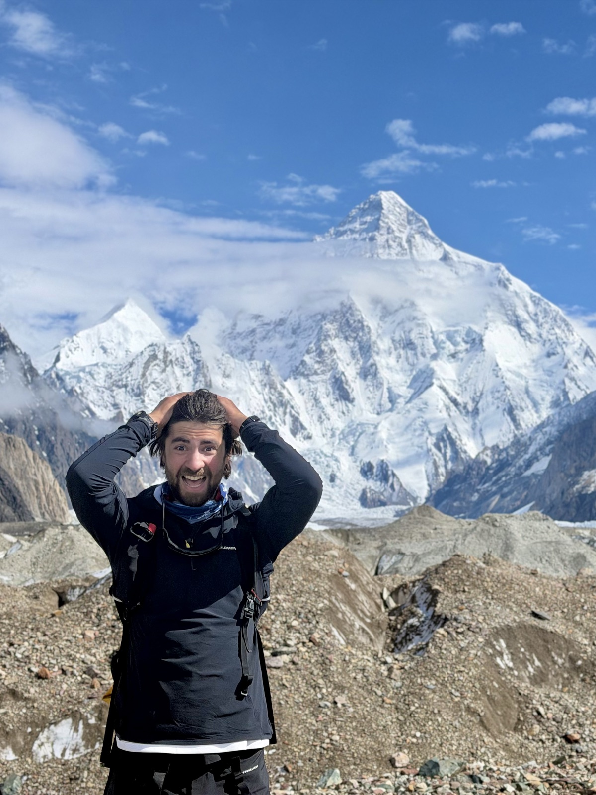 James Jackson at Concordia in the Karakoram, with K2 rising behind him
